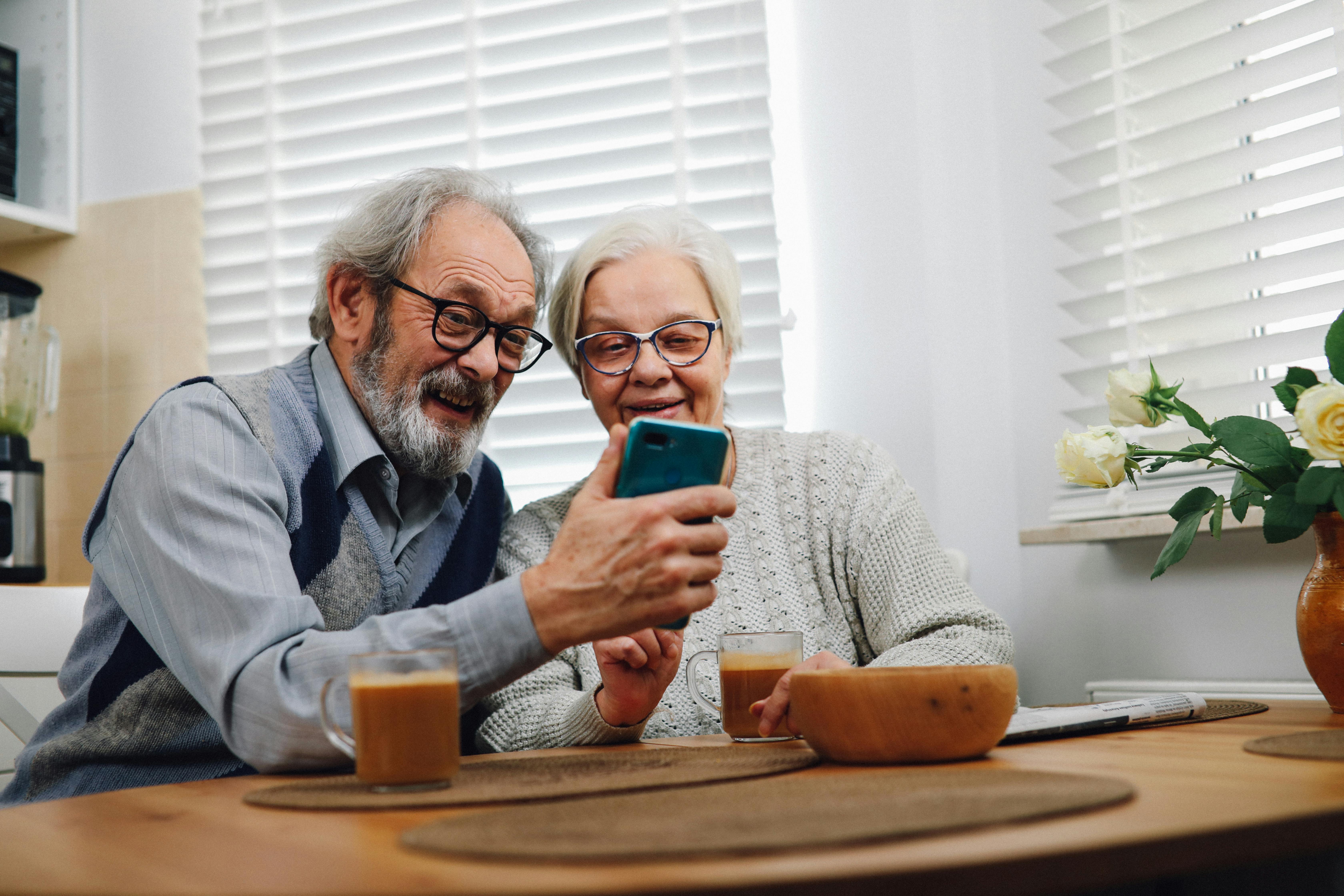 Senior couple reviewing Medicare plan options on a tablet
